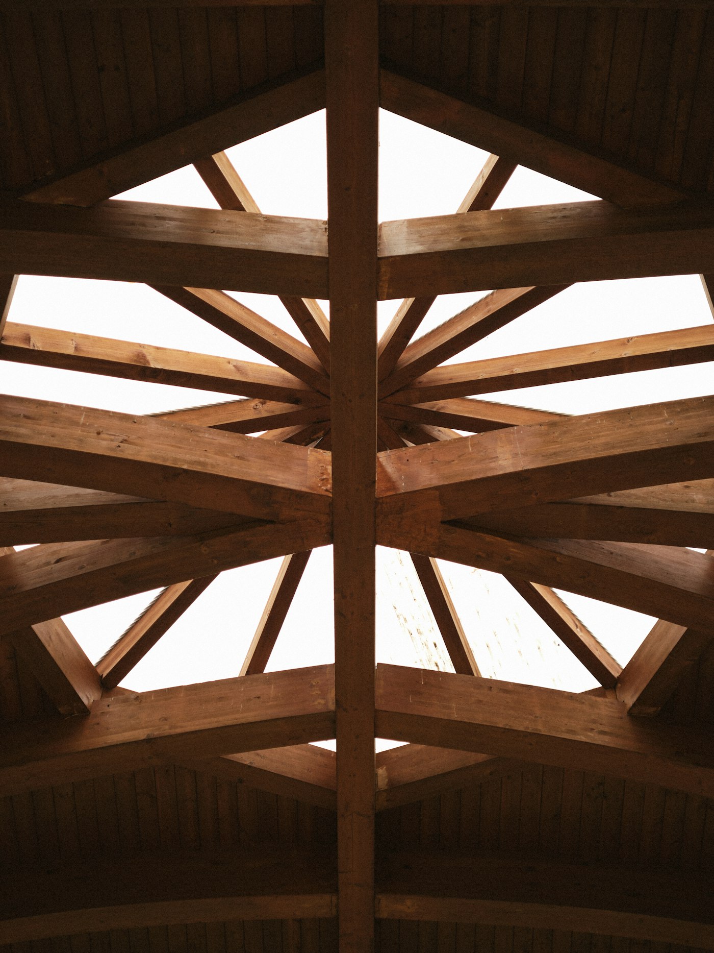 Geometric timber ceiling beams in natural light